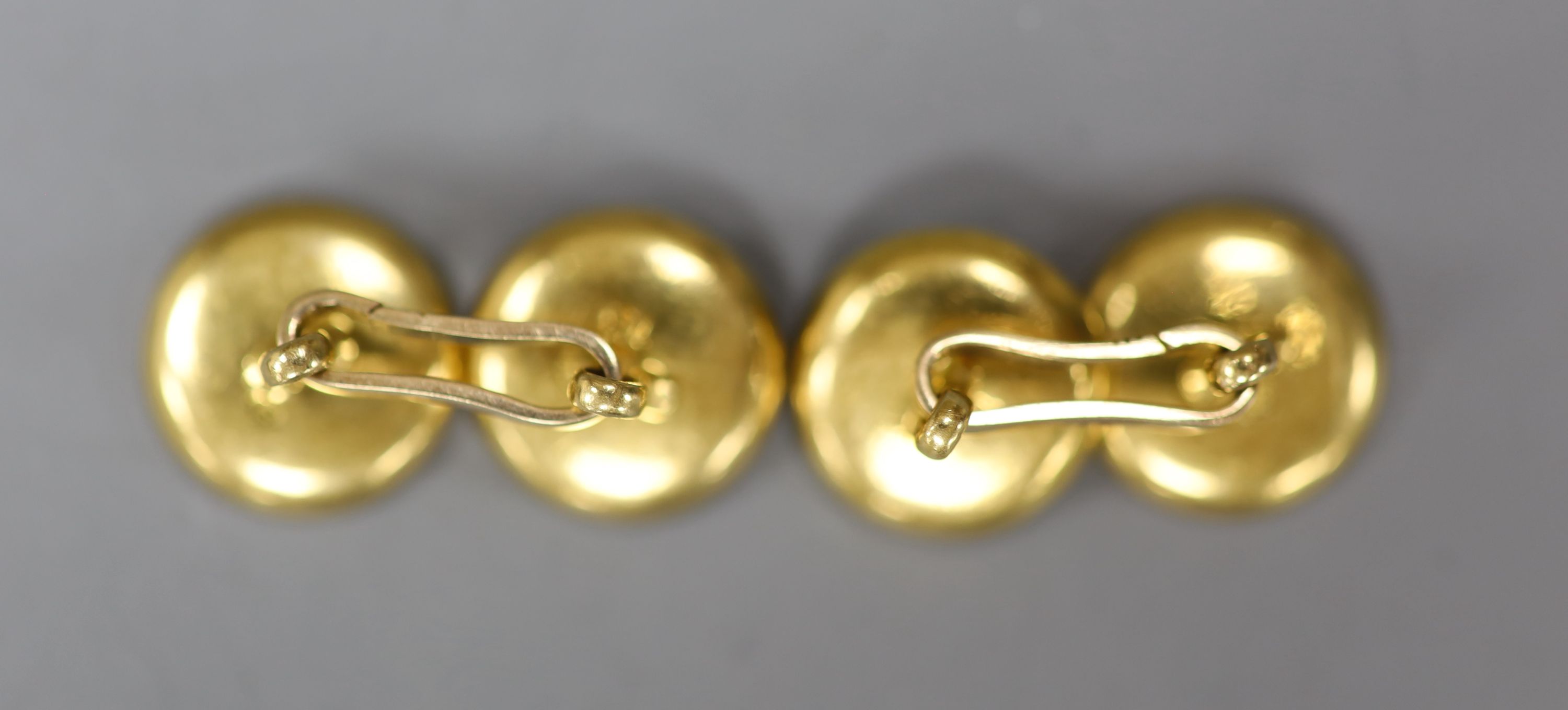 A pair of yellow metal(stamped 18), mother of pearl and seed pearl set disc cufflinks( 2 pearls missing), 14mm, gross 8.7 grams.